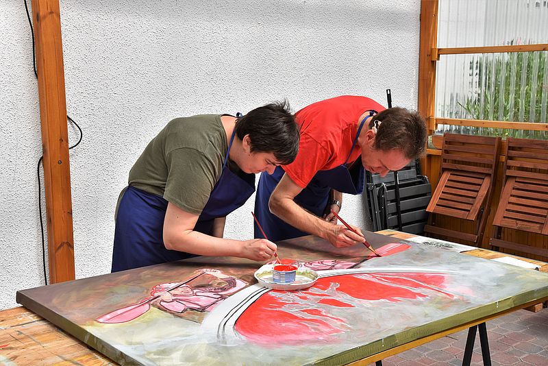 Gemeinsam an einem Werk arbeiten